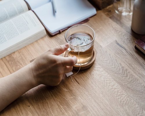 Person taking a break with a cup of tea
