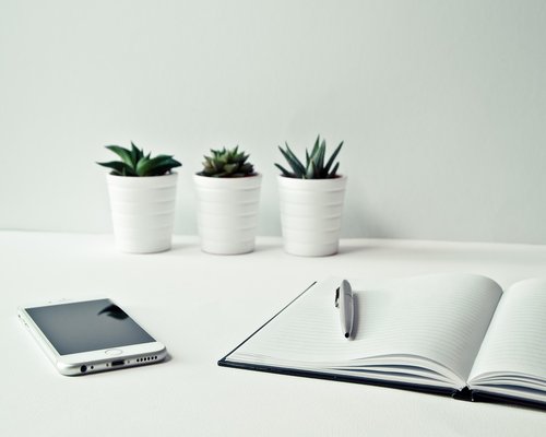 Notebook and pen on a clean desk
